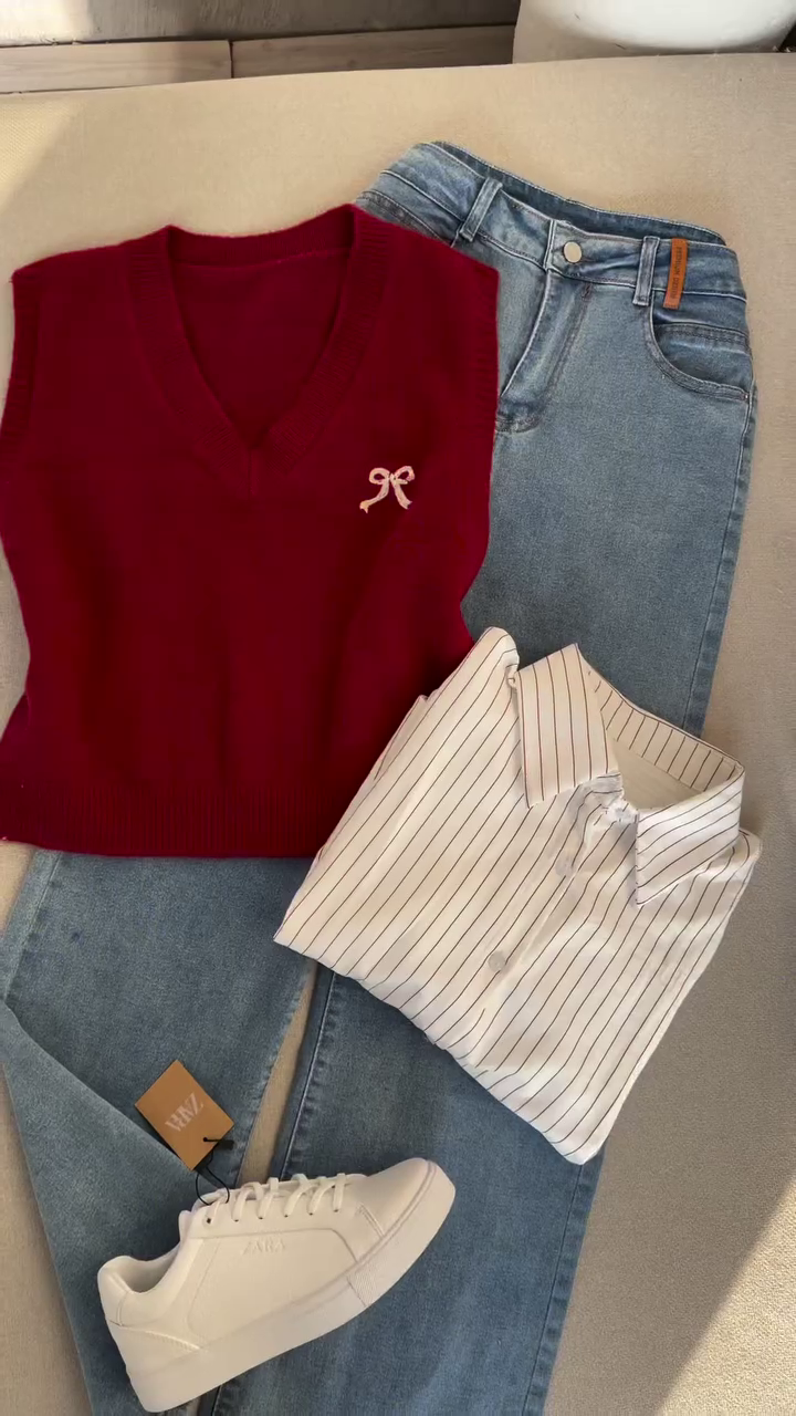 Coordinated Casual Outfit with Striped White Shirt, Maroon Knit Vest, Light Blue Denim Jeans, and White Sneakers 👕👖🧥👟✨