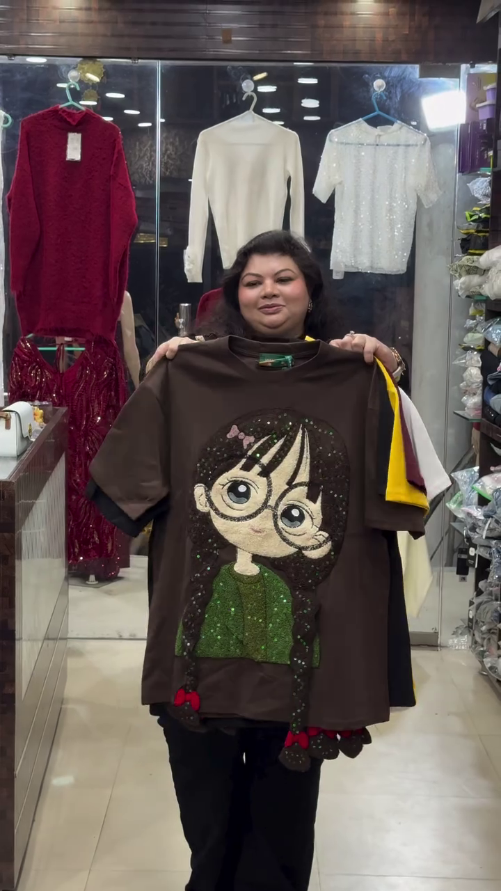 Brown T-Shirt 👕 with Decorative Cartoon Girl Graphic 👧 + 3D Braided Hair 🎀 + Glittery Green Top ✨ Statement Piece