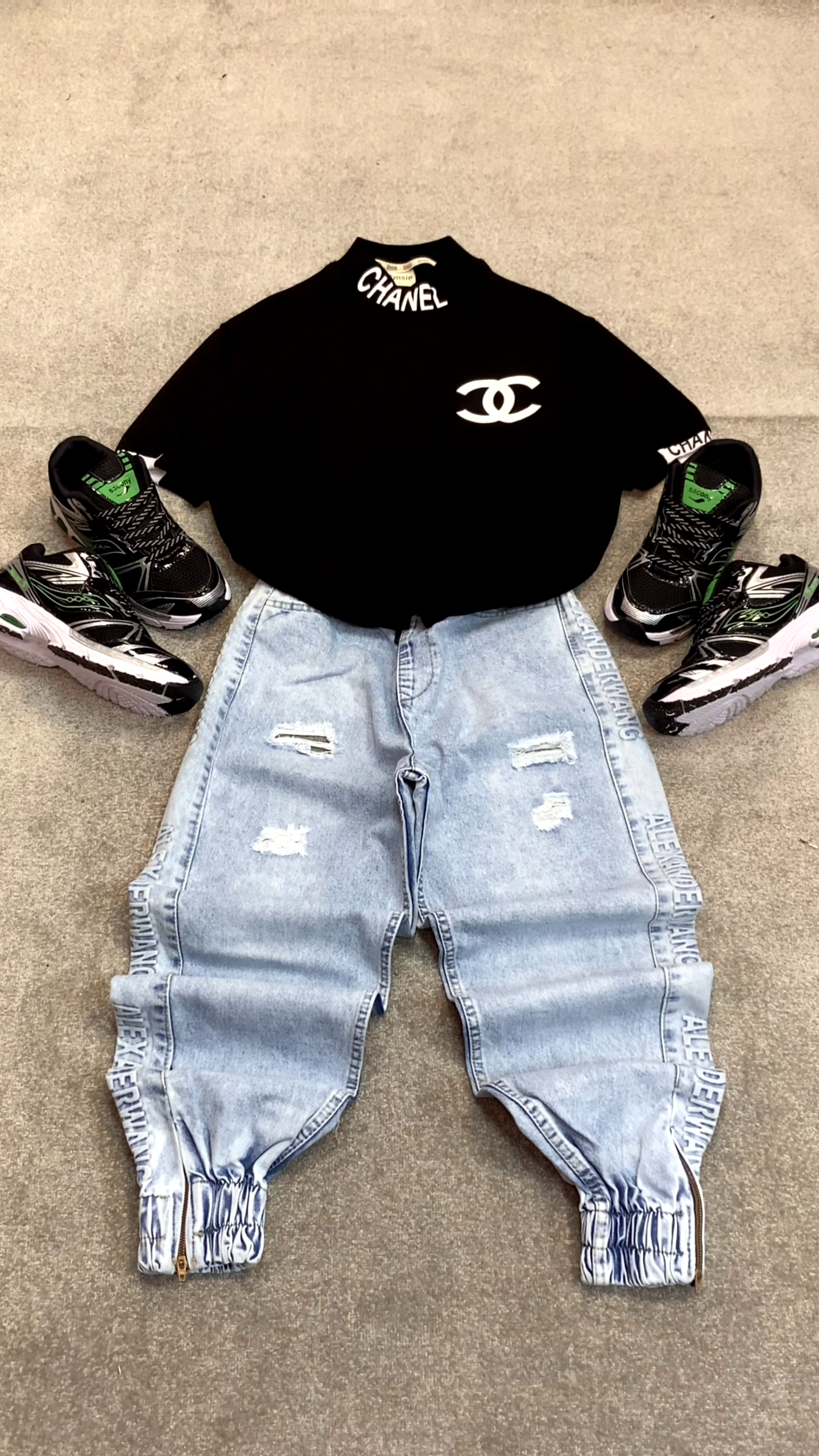 Bright Pink T-Shirt 👕 with Prominent White Logo ✨ + Light Blue Distressed Jeans 👖 + Silver Sneakers 👟 Casual Ensemble