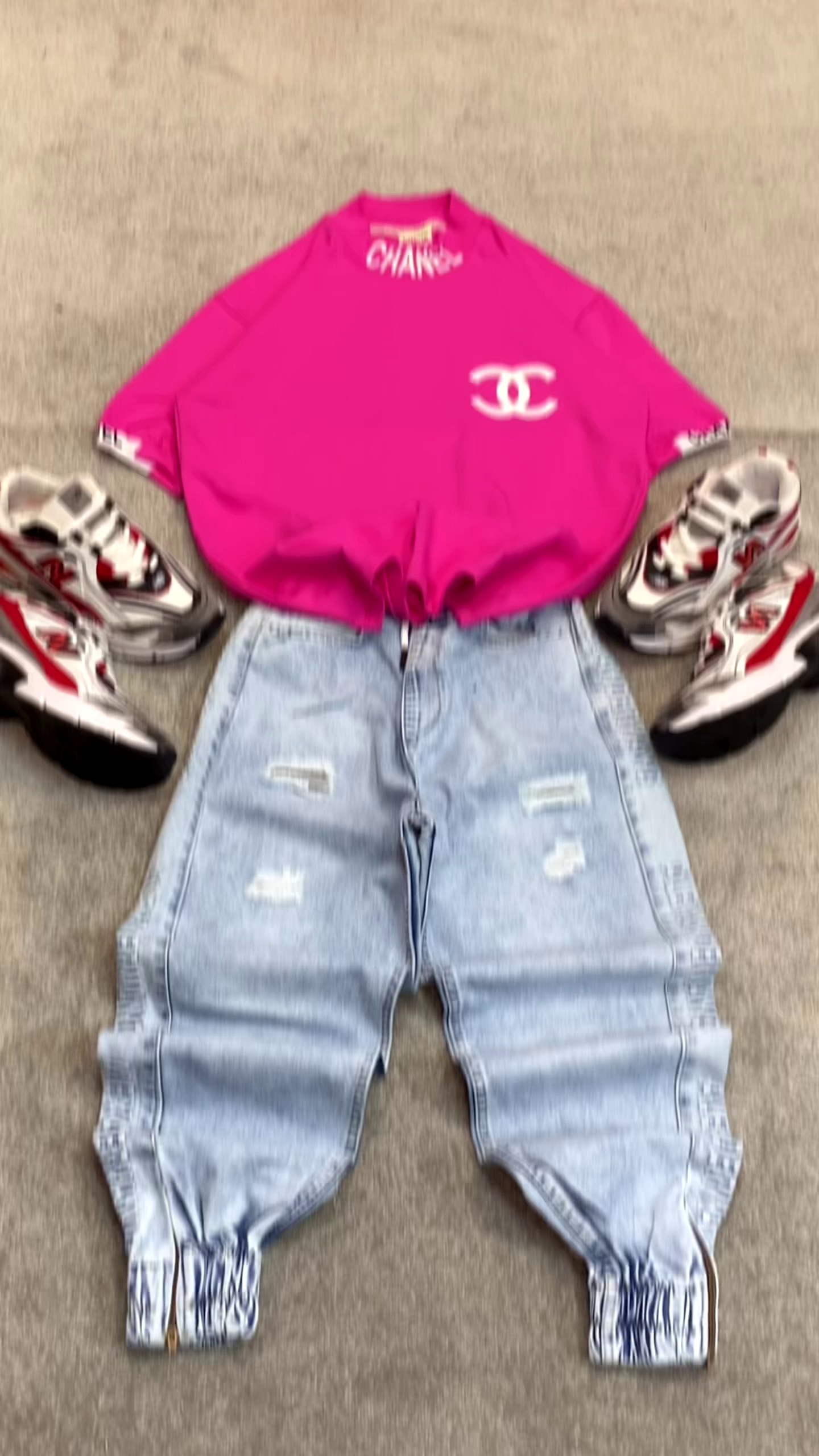 Bright Pink T-Shirt 👕 with Prominent White Logo ✨ + Light Blue Distressed Jeans 👖 + Silver Sneakers 👟 Casual Ensemble