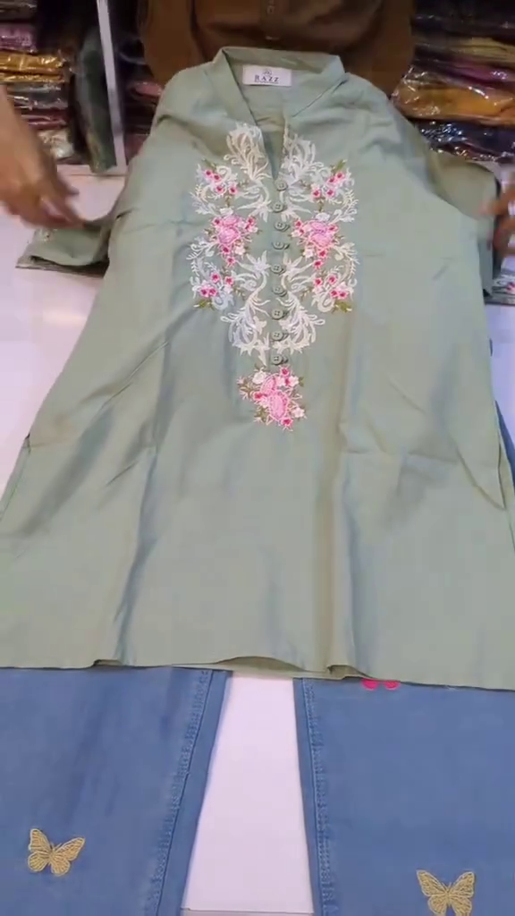 Pastel Sage Green Floral Heavy Embroidered A-Line Kurti Top Paired with Butterfly Motif Light Wash Denim