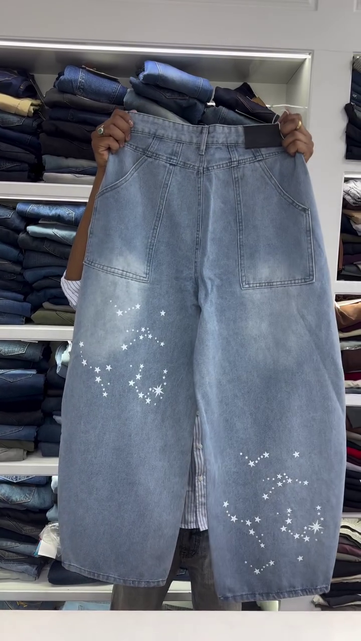 Light Wash High-Rise Wide Leg Denim Jeans with White Star Galaxy Print Pattern and Soft Faded Finish