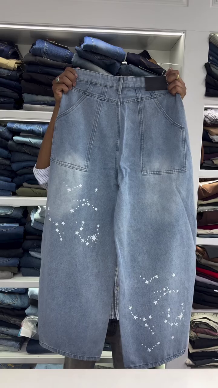 Light Wash High-Rise Wide Leg Denim Jeans with White Star Galaxy Print Pattern and Soft Faded Finish