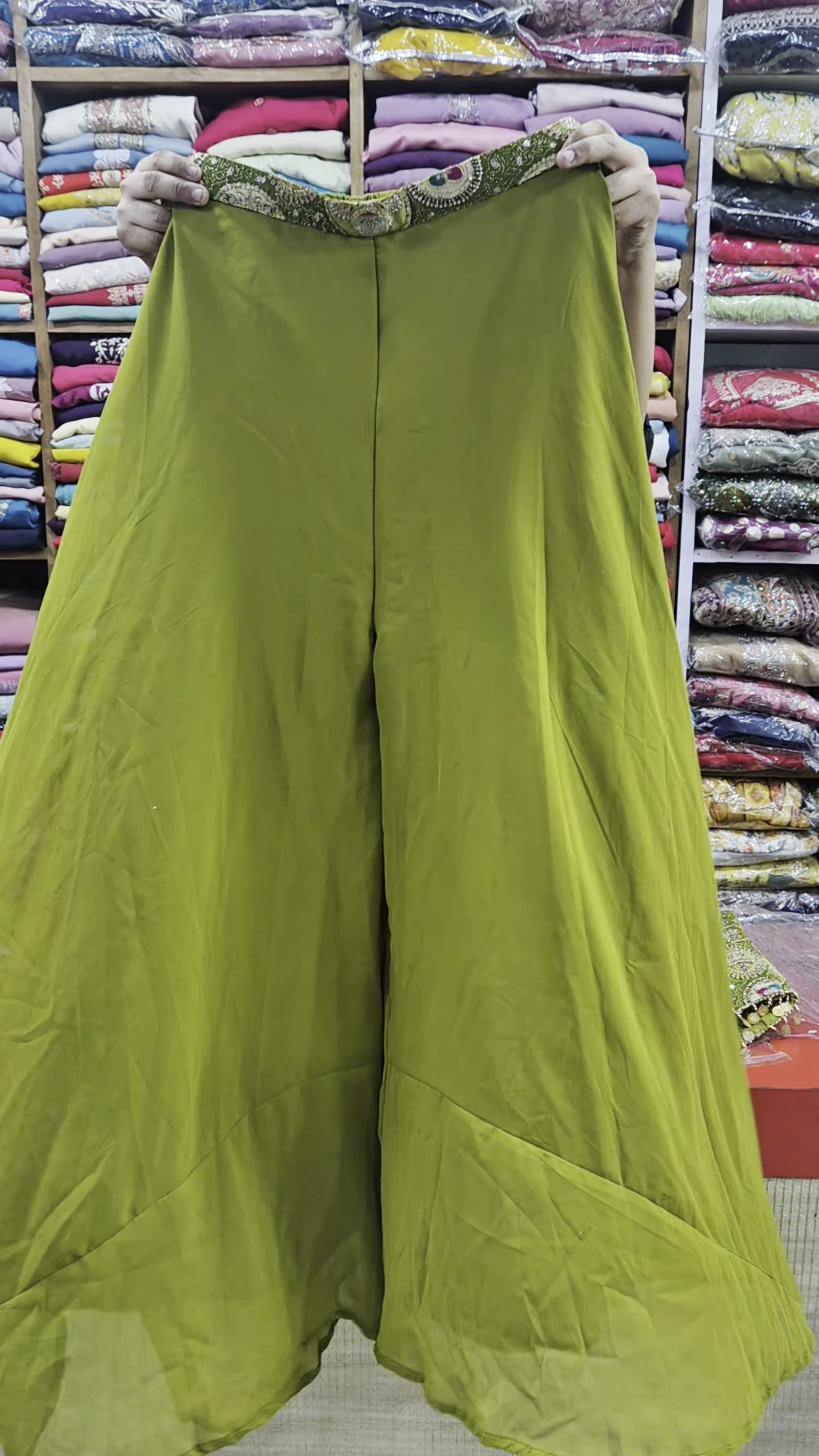 Olive Green Heavy Embroidered Short Kurti with Mirror & Thread Circular Motif Work Paired with Matching Flowy Palazzo Pants and Coordinated Dupatta – Festive Ethnic Three-Piece Set